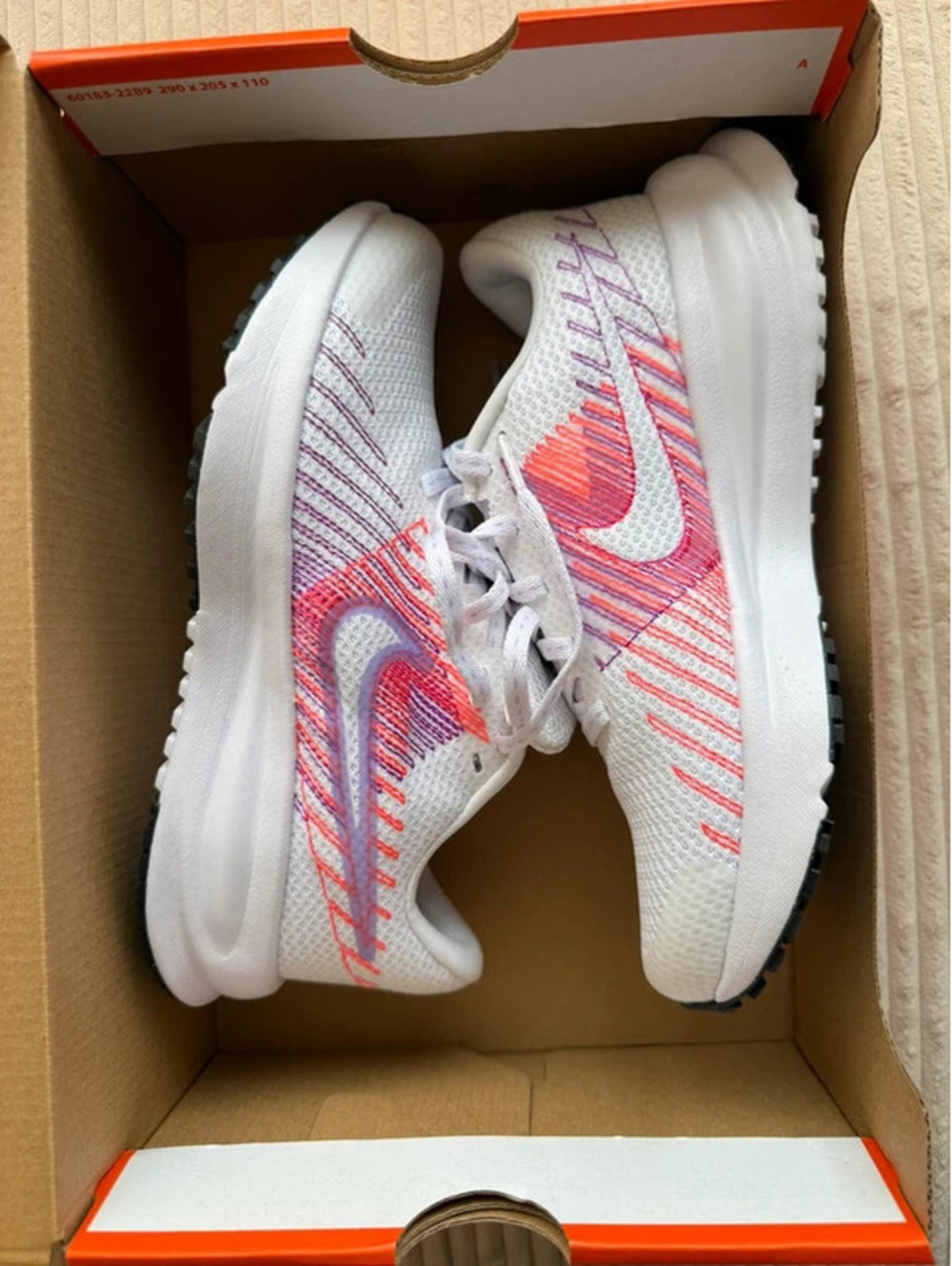Women’s Nike Run Defy Sneakers